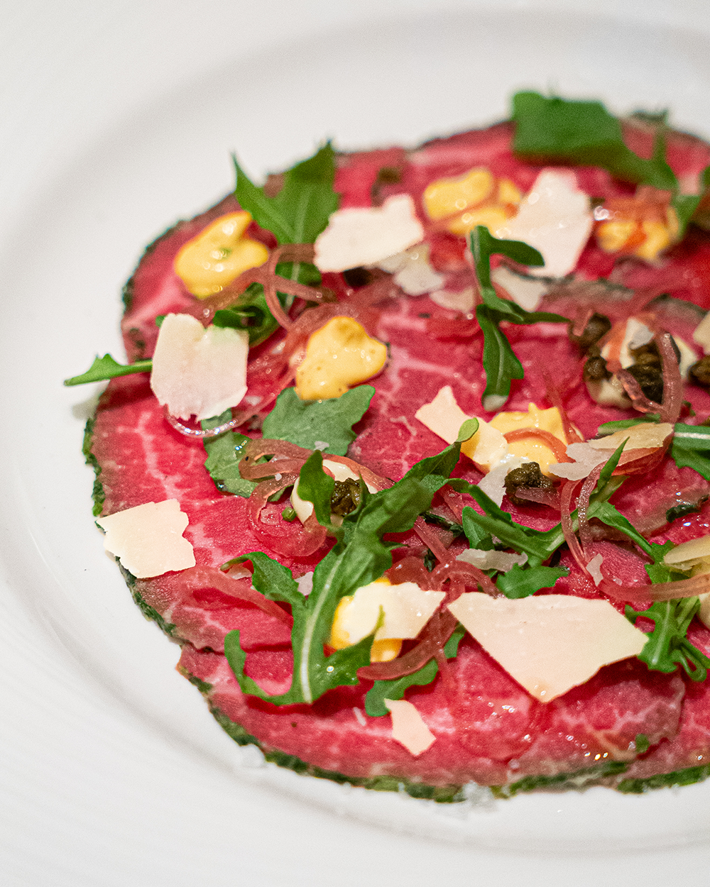 Charlie Palmer Steak at Grand Sierra Resort's Beef Carpaccio for 2026 Reno Food & Drink Week. Photo by Fullsphere Digital.