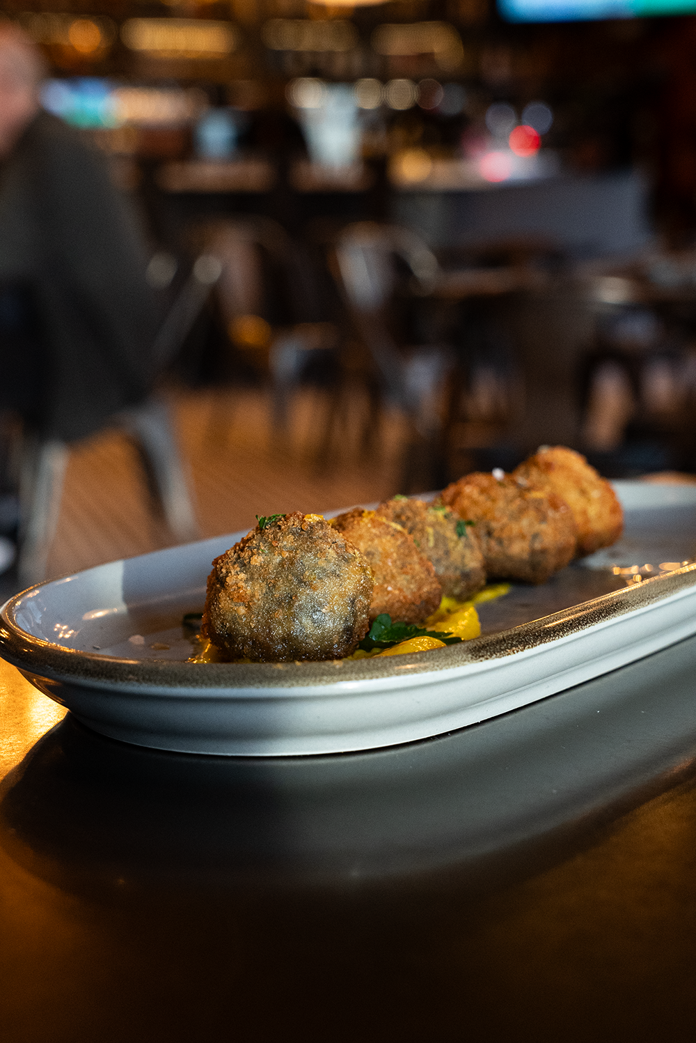 Liberty Food & Wine Exchange's Squid Ink Arancini for 2026 Reno Food & Drink Week. Photo by Fullsphere Digital.